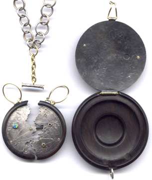 Opened pendant showing earrings