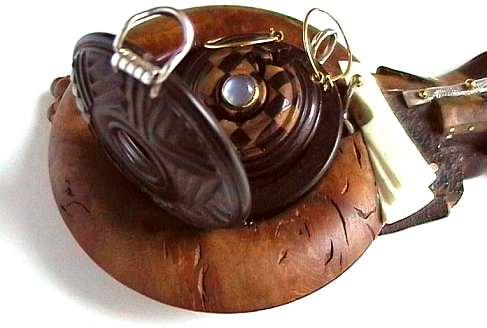 wallpiece holding open pendant and earrings